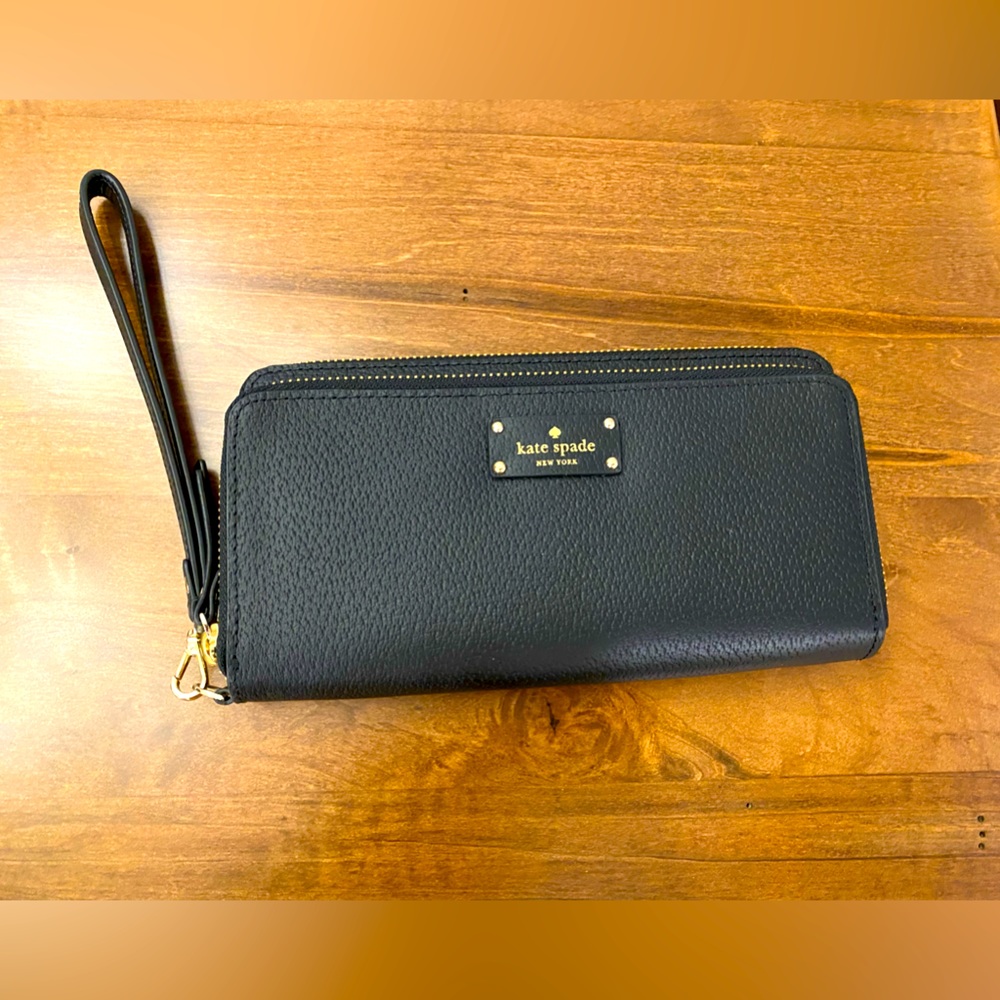Brand new, never used Kate Spade black wristlet wallet with strap.